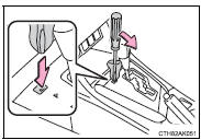 5 Press the shift lock override button.