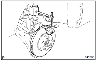 Toyota Corolla. Inspect disc runout