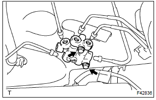 Toyota Corolla.  Remove proportioning valve assy