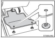 2 Turn the upper knob of each retaining hook (clip) to secure the floor mats