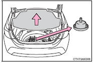 2 Set the jack attachment on the floor jack and position the jack.