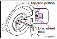 When replacing an aluminum wheel with a compact spare tire, tighten the wheel