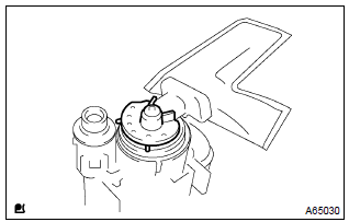 Toyota Corolla.  Remove fuel pump cushion rubber