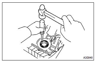 Toyota Corolla. Remove timing gear cover oil seal