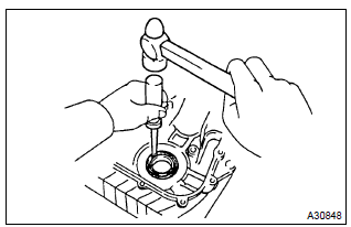 Toyota Corolla. Remove timing gear cover oil seal