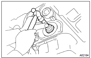 Toyota Corolla.  Install timing gear cover oil seal