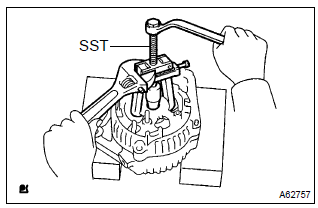 Toyota Corolla. Remove generator rectifier end frame