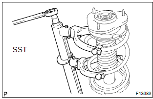 Toyota Corolla.  Remove shock absorber assy front lh