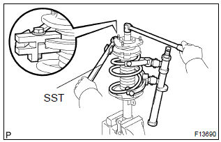 Toyota Corolla. Install shock absorber assy front lh