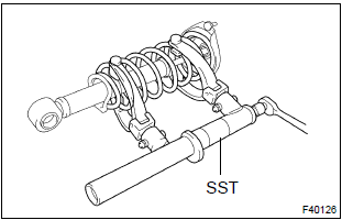 Toyota Corolla. Remove shock absorber assy rear lh