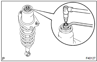 Toyota Corolla. Remove shock absorber assy rear lh