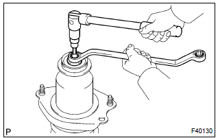 Toyota Corolla. Install shock absorber assy rear lh