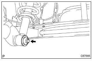 Toyota Corolla. Fully tighten rear shock absorber with coil spring