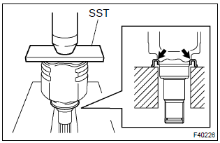 Toyota Corolla.  Install front drive shaft dust cover lh