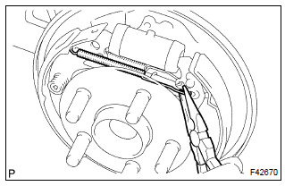 Toyota Corolla. Remove rear brake automatic adjust lever lh