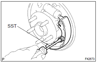 Toyota Corolla. Remove rear brake shoe