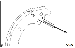 Toyota Corolla. Install front brake shoe