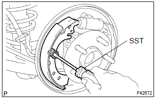 Toyota Corolla. Install front brake shoe