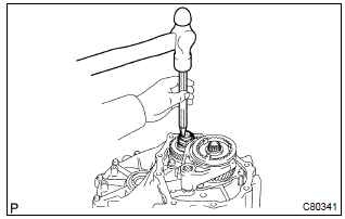 Toyota Corolla. Remove manual transmission output shaft rear set nut