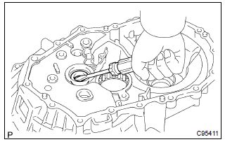 Toyota Corolla.  Remove front transaxle case oil seal