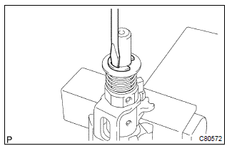 Toyota Corolla. Remove select spring seat no.2