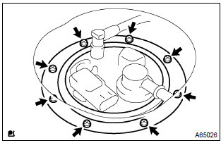 Toyota Corolla.  Remove fuel tank vent tube set plate
