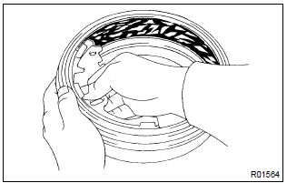 Toyota Corolla. Inspect brake drum and rear drum brake shoe lining for proper contact