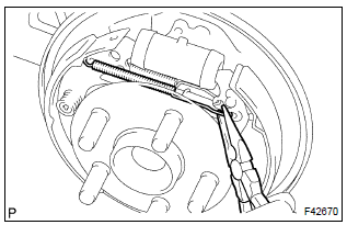 Toyota Corolla.  Install rear brake automatic adjust lever lh