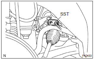 Toyota Corolla. Disconnect pressure feed tube assy